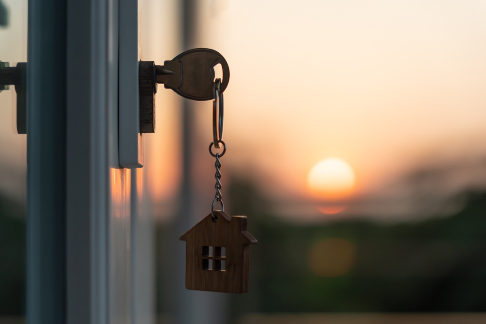 Landlord,Key,For,Unlocking,House,Is,Plugged,Into,The,Door.